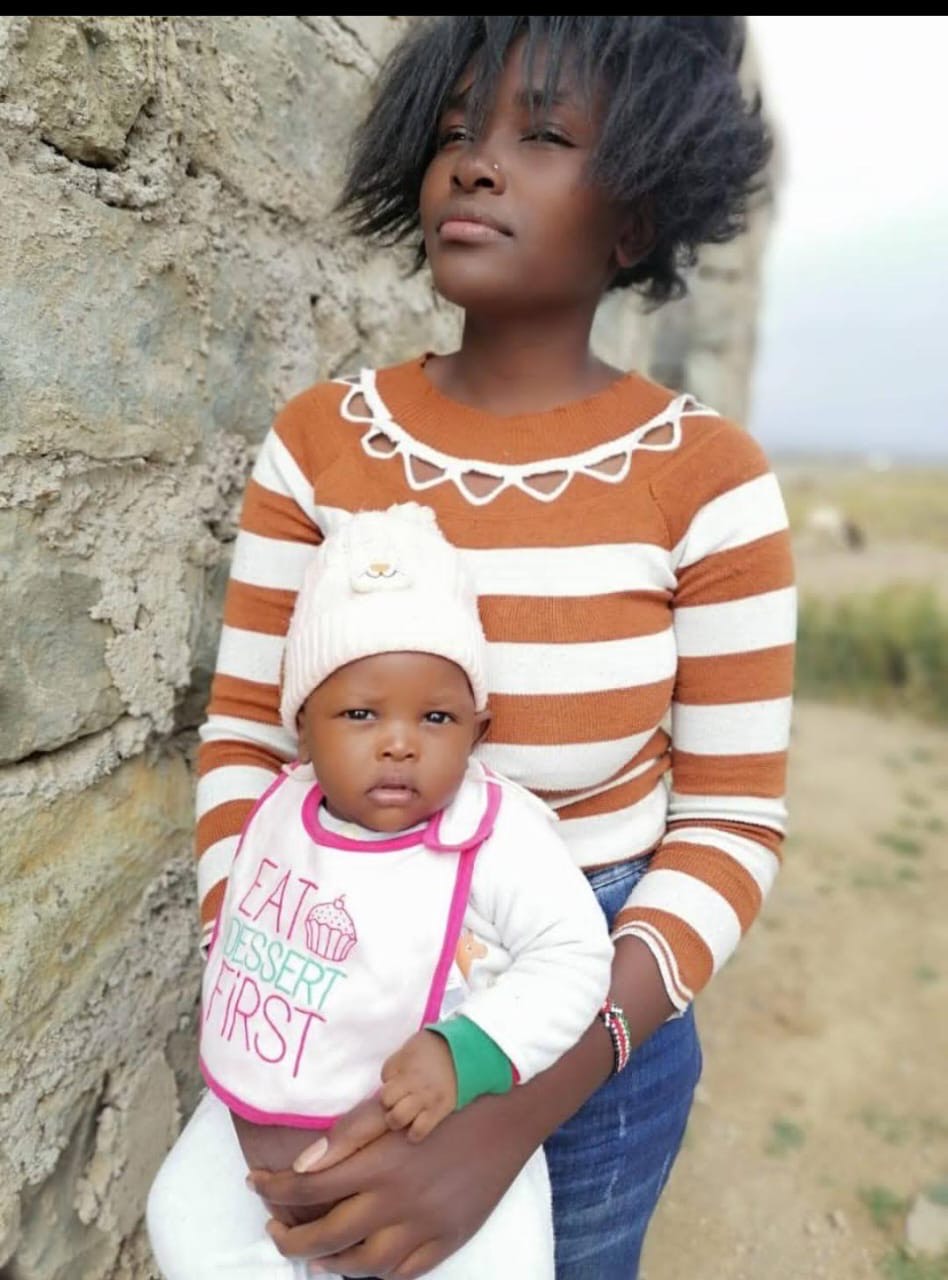 Pheebs holding Roy in Kenya